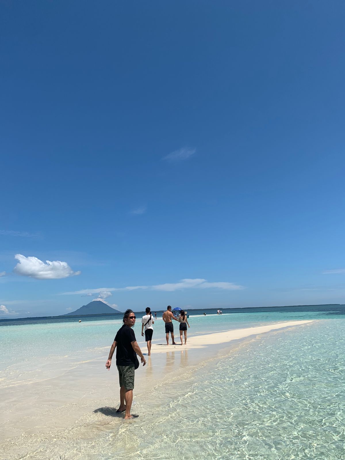 White sandbar with Manado Tua backdrop